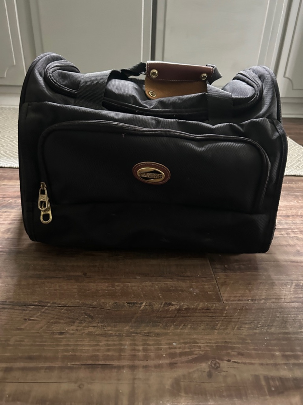 American Tourister Black Duffel Bag with Brown Accent